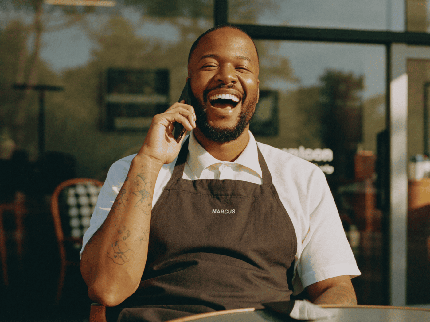 A barber relaxing on a day off while the shop keeps booking without him